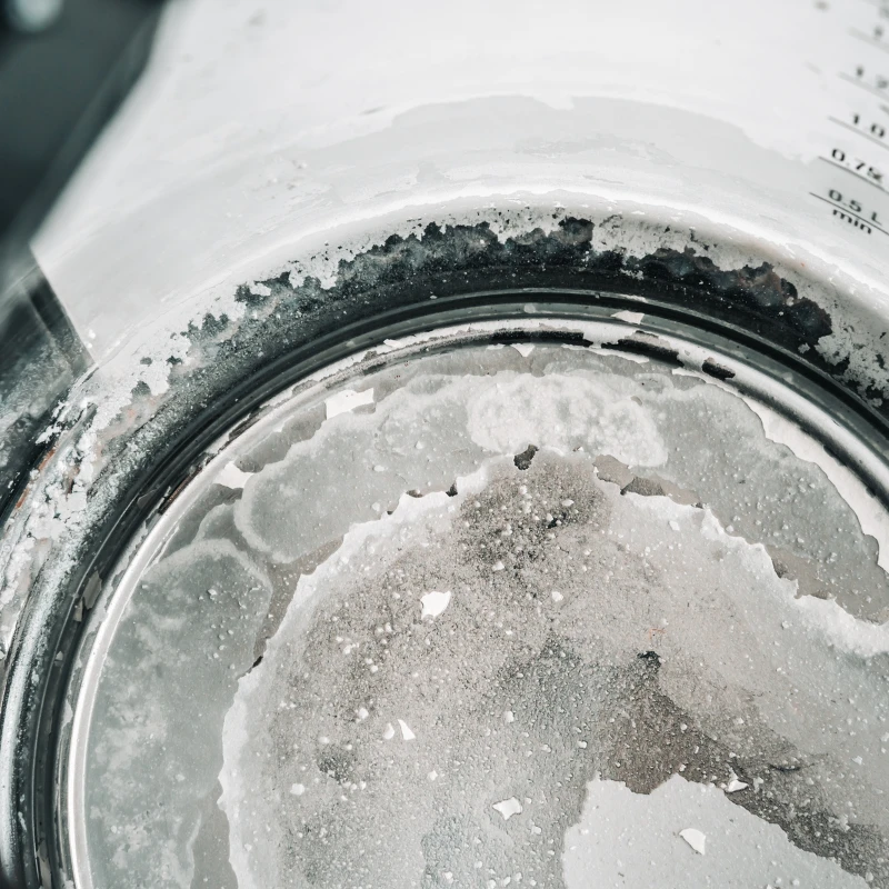 Hard water build-up at the bottom of a kettle