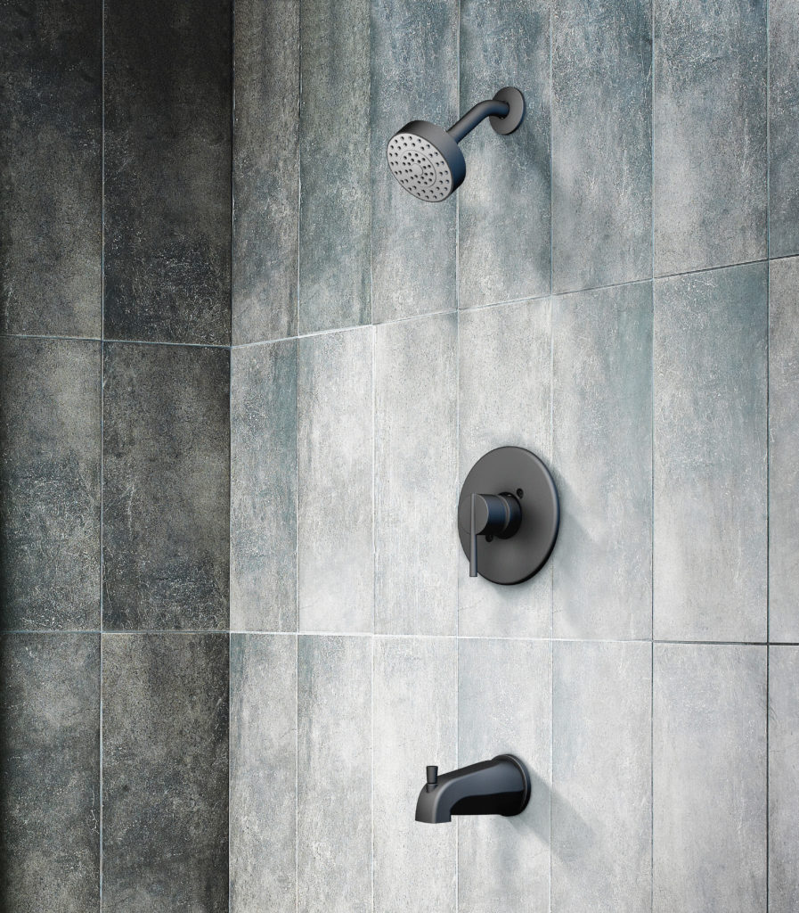 This shower has elongated, darker tiles as the siding. The fixtures have a matte gunmetal finish.